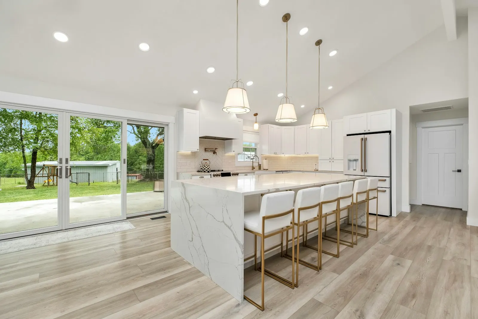 After: open-plan kitchen with a steel lintel where the load-bearing wall stood